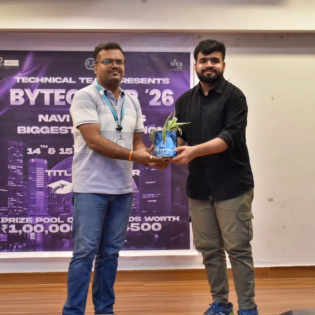 A hand-painted planter being presented on stage in front of the ByteCamp '26 backdrop.
